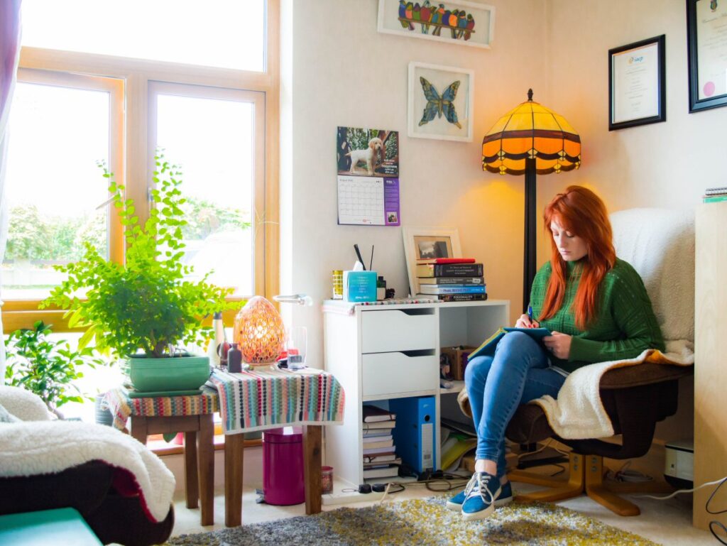 Picture of Amy Hill, Clonmel-based counsellor and psychotherapist, at work in her home office. Image is used on the What is counselling and psychotherapy page of this web site?