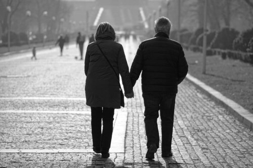 Image used for the couples therapy page is a black and white photo of a couple, seen from behind, walking hand-in-hand down a paved street.