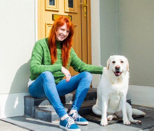 A picture of Amy Hill and her therapy dog, Robyn.